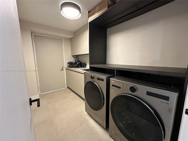 17875 Collins Ave Unit 1801, Sunny Isles Beach, FL 33160 - laundry area featuring washer and clothes dryer and cabinet space