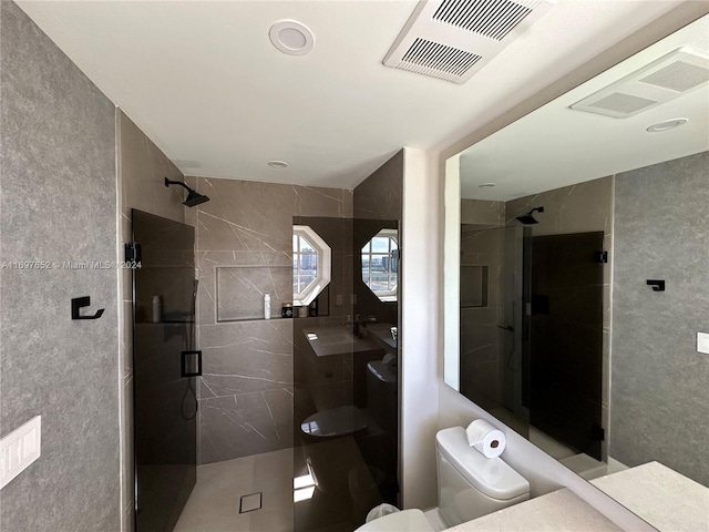 17875 Collins Ave Unit 1801, Sunny Isles Beach, FL 33160 - bathroom featuring vanity, a stall shower, and tile walls