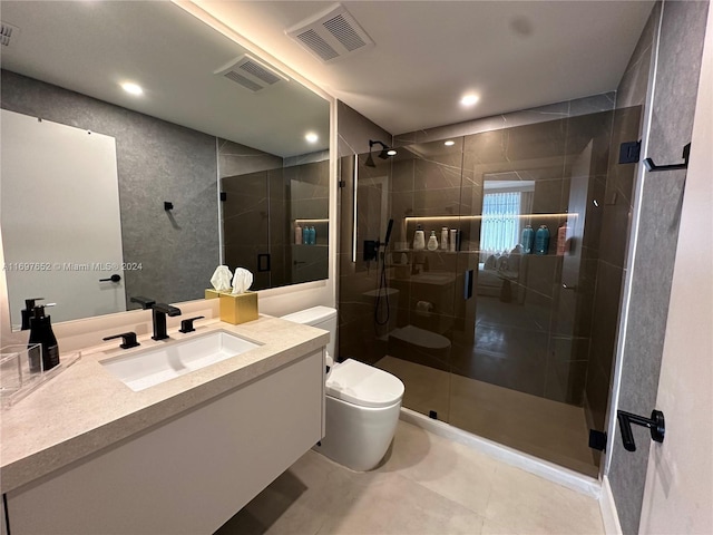 bathroom featuring vanity, toilet, and an enclosed shower