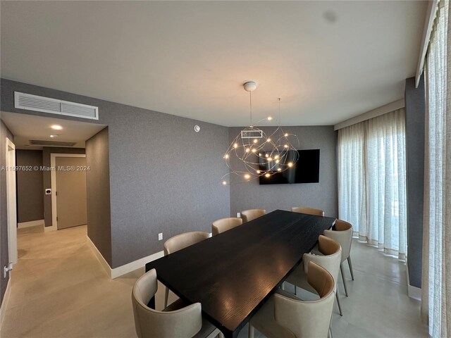 dining area with a notable chandelier