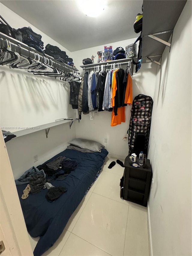 spacious closet with tile patterned floors