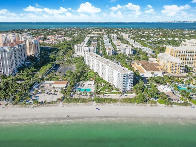 aerial view featuring a water view and a beach view