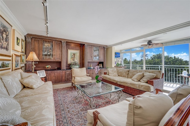 living room featuring expansive windows, ceiling fan, rail lighting, and ornamental molding