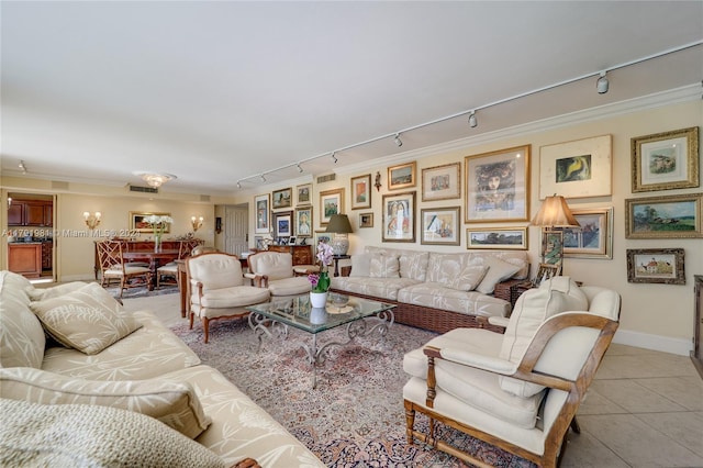 living room with light tile patterned floors, rail lighting, and ornamental molding