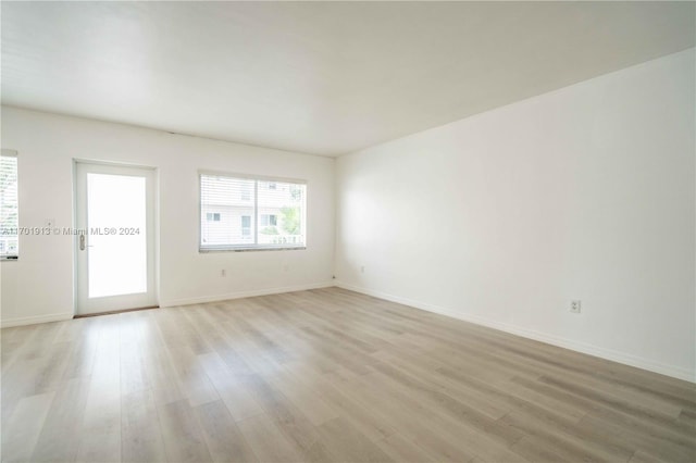 unfurnished room featuring light hardwood / wood-style flooring