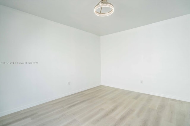 spare room featuring light hardwood / wood-style floors