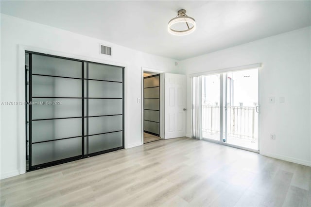 unfurnished bedroom with light hardwood / wood-style flooring