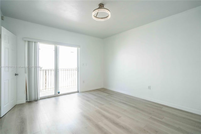 unfurnished room featuring light hardwood / wood-style flooring