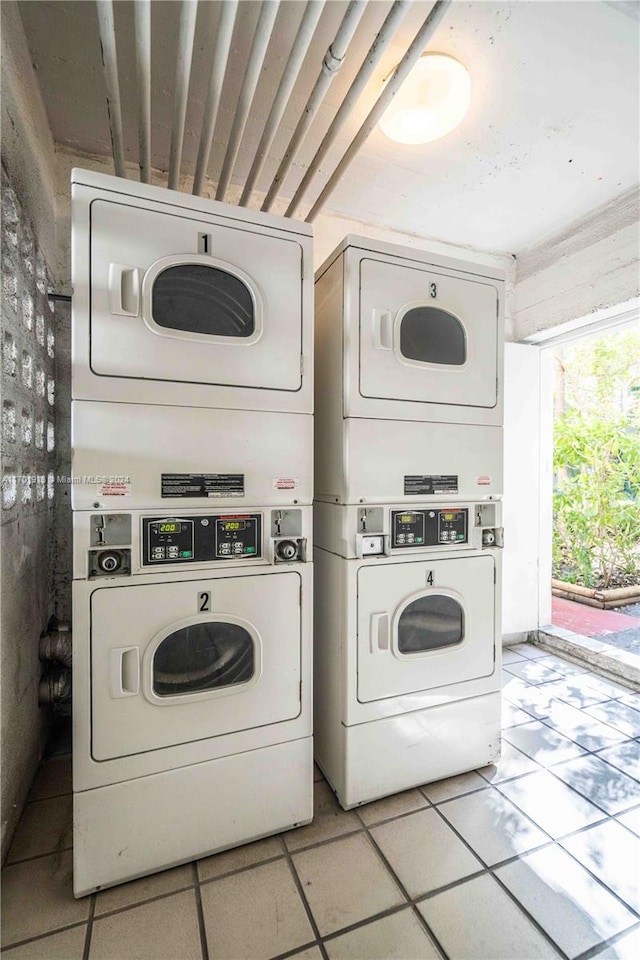 clothes washing area featuring separate washer and dryer and stacked washer and dryer