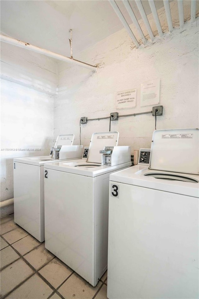 washroom with washing machine and dryer