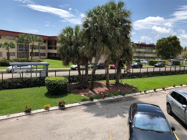 view of community featuring a yard