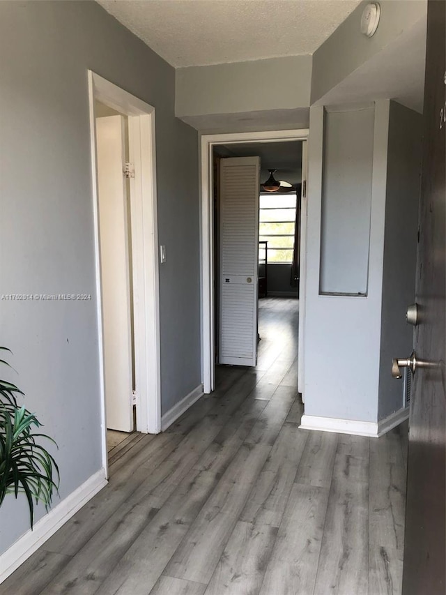 18900 NE 14th Ave Unit D204, Miami, FL 33179 - spare room featuring baseboards, a smoke detector, and wood finished floors