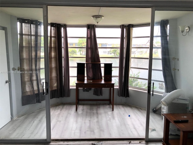 sunroom / solarium featuring plenty of natural light