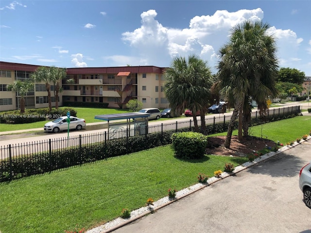 view of property's community featuring a yard