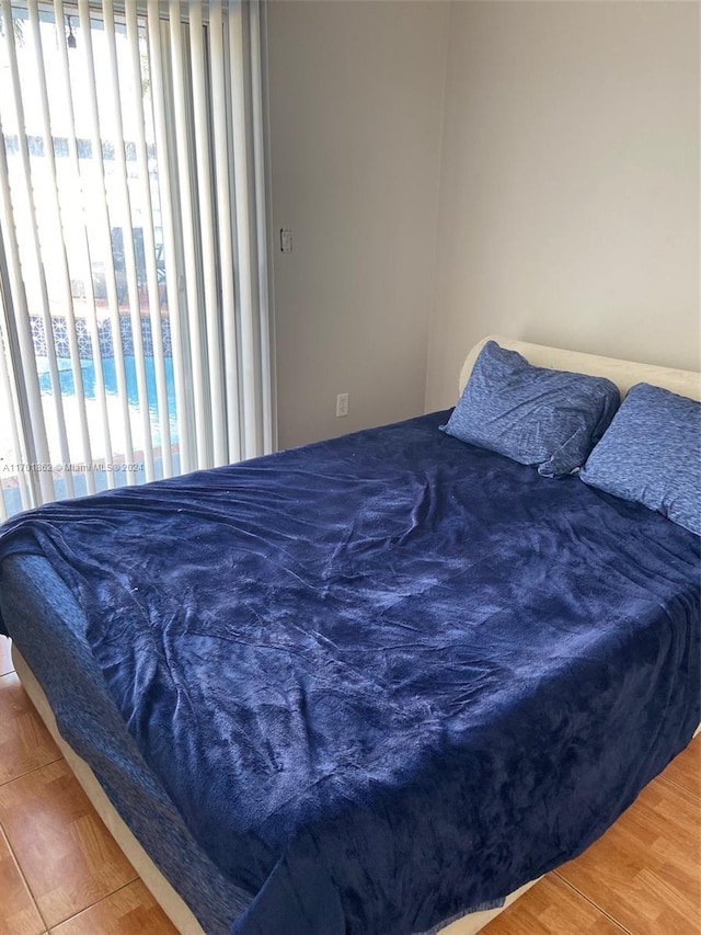 bedroom with hardwood / wood-style floors