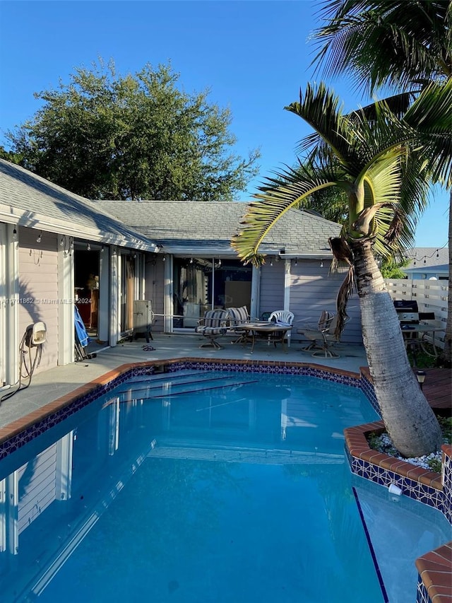 view of swimming pool with a patio