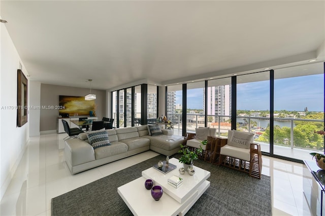 tiled living room featuring plenty of natural light and a wall of windows