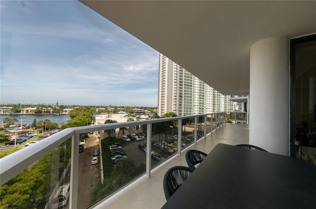 balcony featuring a water view