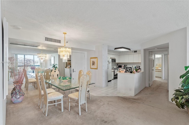 carpeted dining area with a textured ceiling