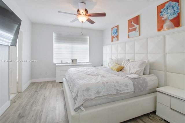 bedroom featuring ceiling fan and light hardwood / wood-style flooring