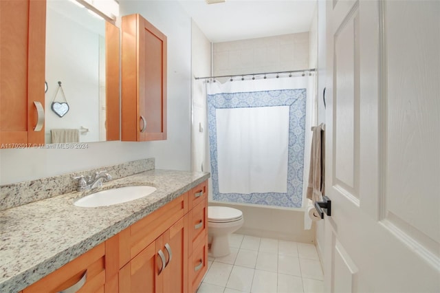 full bathroom featuring tile patterned flooring, vanity, toilet, and shower / bath combo with shower curtain