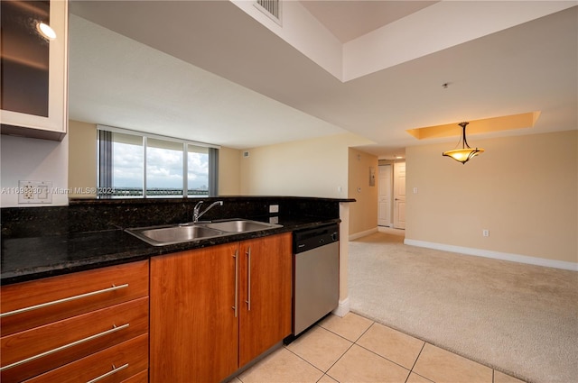 3232 SW 22nd Ter Unit 1504, Miami, FL 33145 - kitchen with stainless steel dishwasher, a sink, brown cabinetry, light carpet, and baseboards
