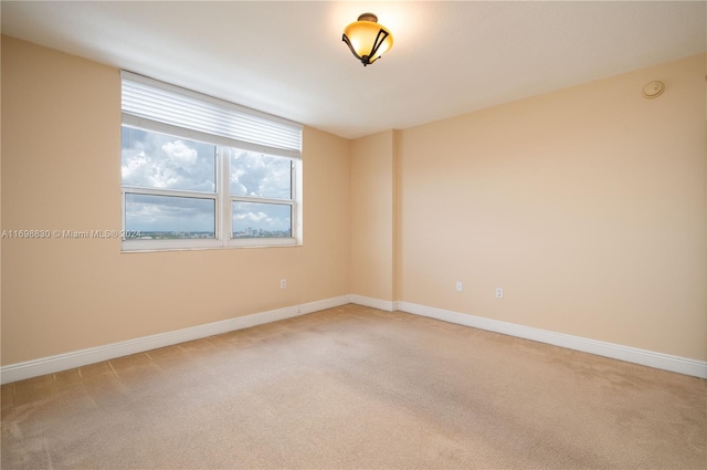 3232 SW 22nd Ter Unit 1504, Miami, FL 33145 - empty room featuring light carpet, baseboards, and a smoke detector