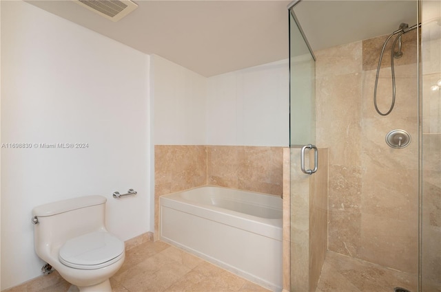 bathroom with tile patterned flooring, toilet, and independent shower and bath