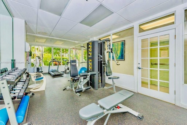 exercise room featuring a drop ceiling