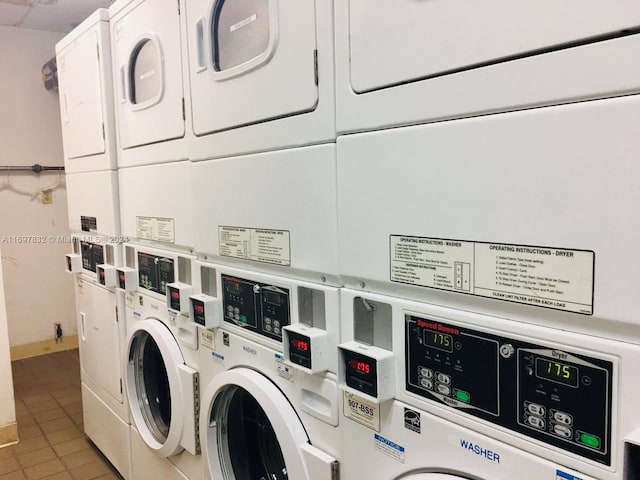 laundry area featuring washer and dryer, stacked washer and dryer, and light tile patterned flooring