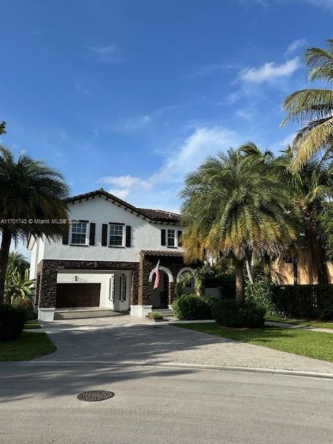 view of front of home with a garage