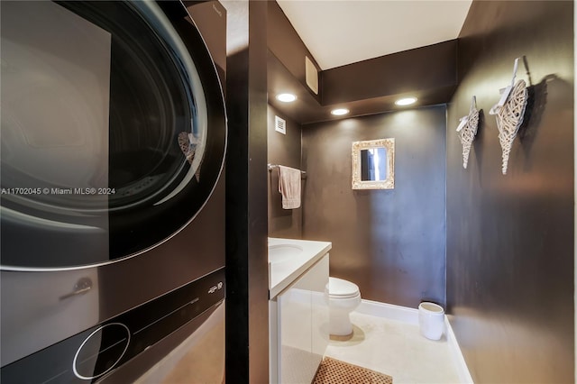 bathroom featuring tile patterned flooring, vanity, and toilet