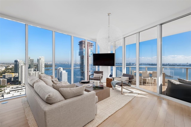 living room featuring hardwood / wood-style floors and a wall of windows