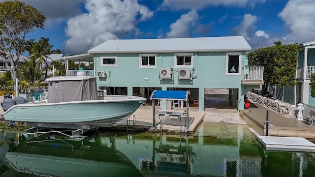 rear view of property featuring a water view