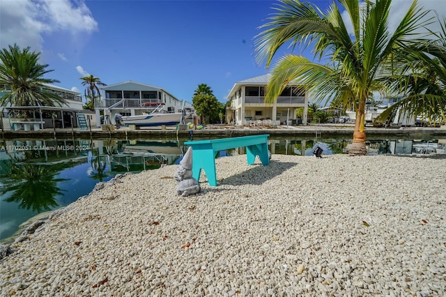 surrounding community featuring a water view