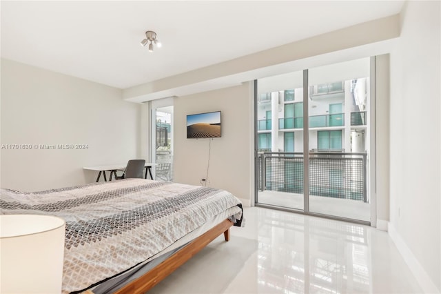 tiled bedroom featuring access to outside and multiple windows