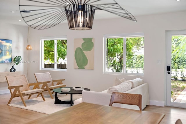 living room featuring light hardwood / wood-style floors and a wealth of natural light