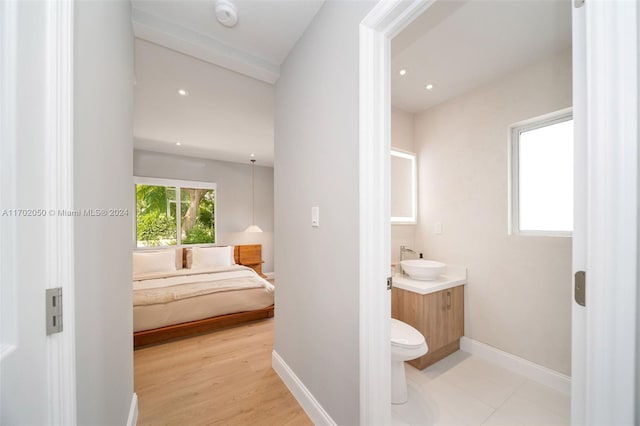 bathroom featuring hardwood / wood-style flooring, vanity, and toilet