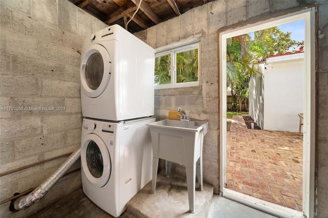 laundry area with stacked washer / drying machine