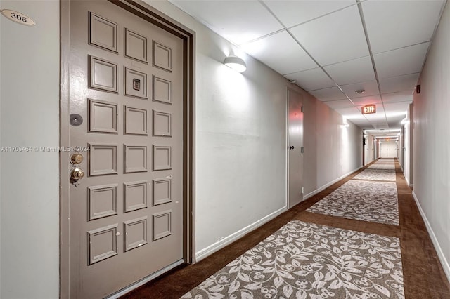 hallway featuring a drop ceiling