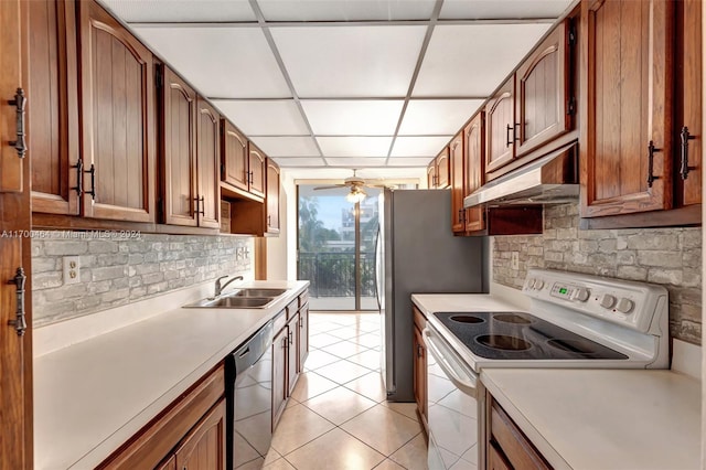 kitchen featuring sink, white electric range, stainless steel dishwasher, a paneled ceiling, and light tile patterned flooring