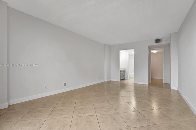 view of tiled spare room