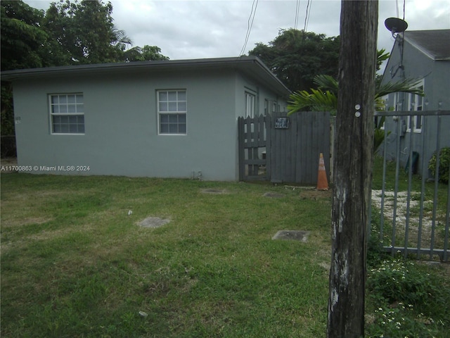 view of home's exterior featuring a lawn