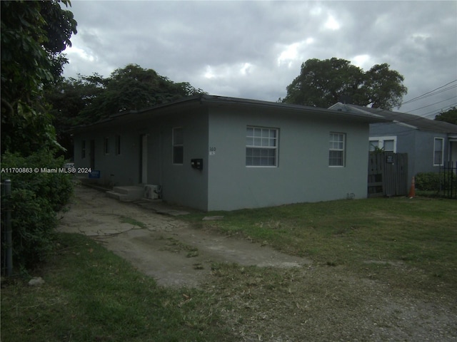 view of home's exterior featuring a yard