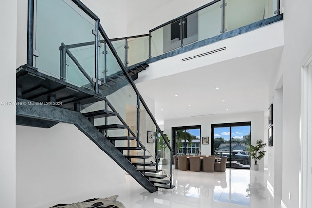 stairs featuring tile patterned flooring