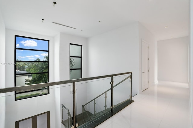 hall with light tile patterned flooring