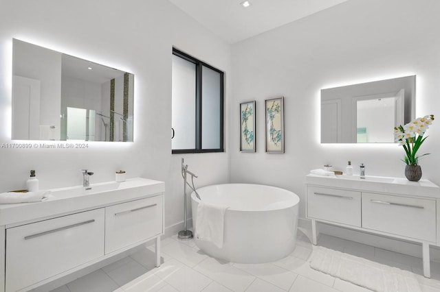 bathroom with tile patterned flooring, vanity, and shower with separate bathtub