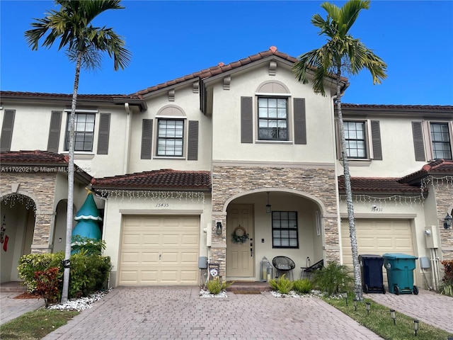 mediterranean / spanish-style house featuring a garage