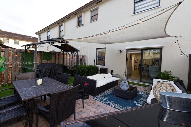 view of patio featuring an outdoor hangout area and a grill