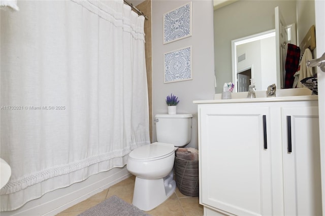 full bathroom with tile patterned flooring, vanity, shower / tub combo, and toilet